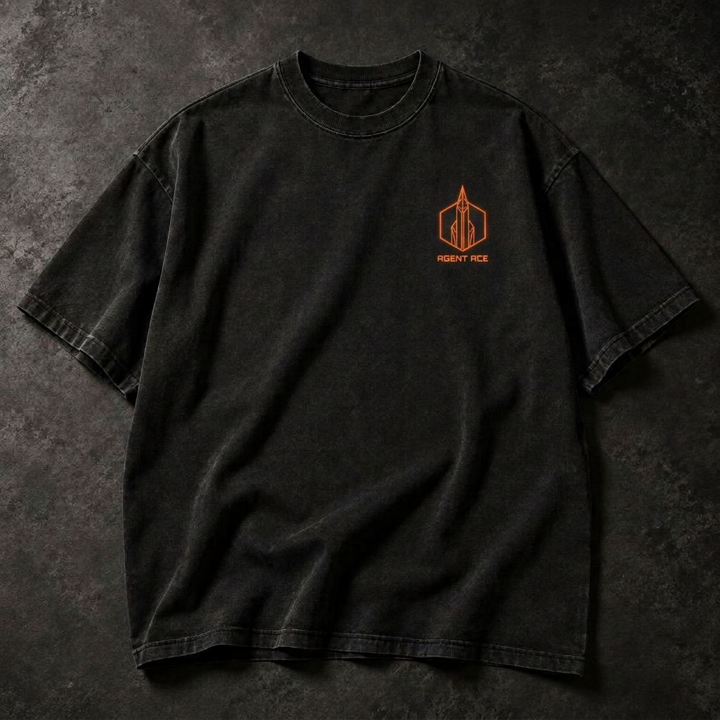 Folded washed-black Agent Ace t-shirt with a small shield emblem on the chest